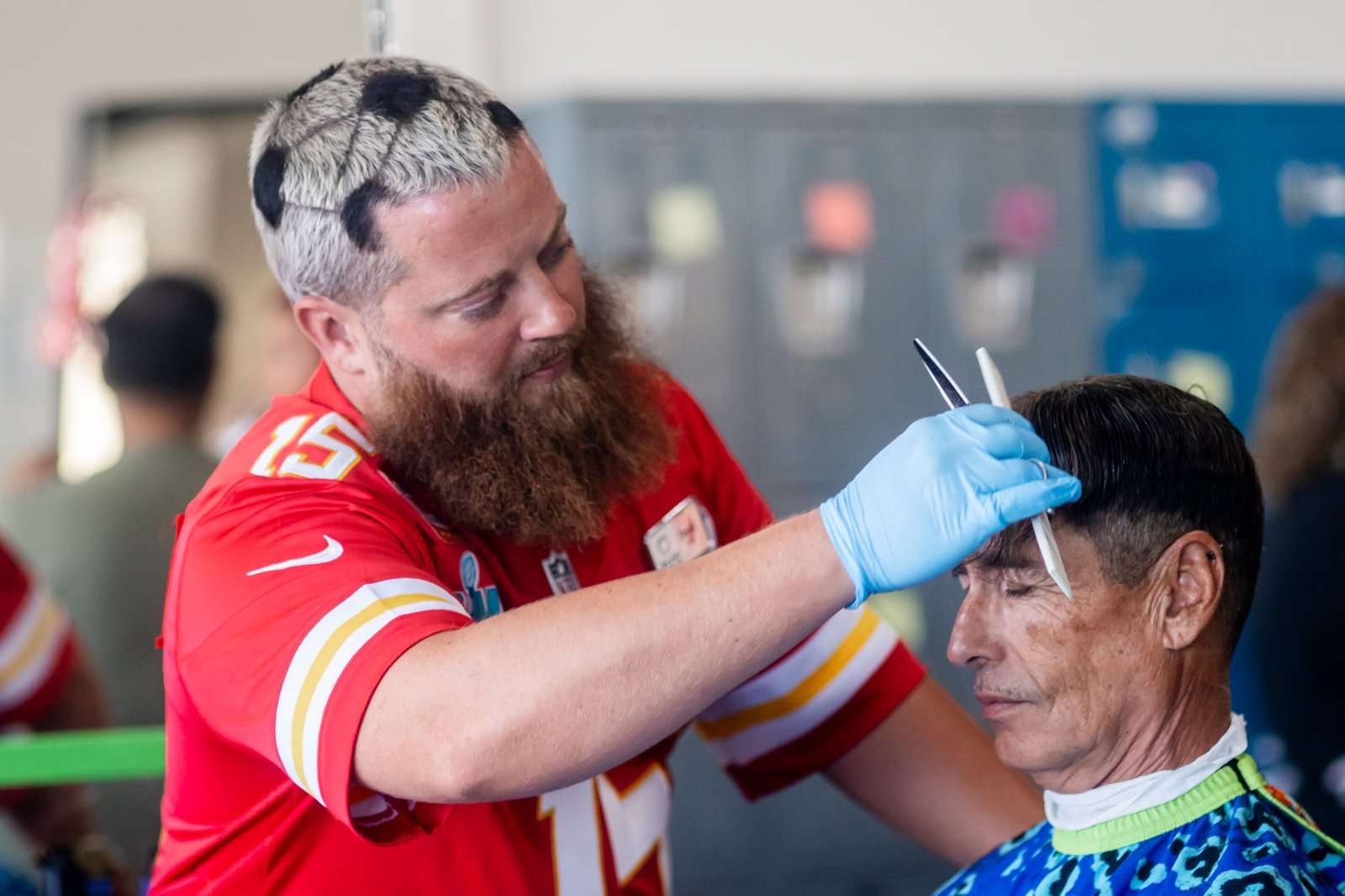 Derek Beatty working on a client's haircut